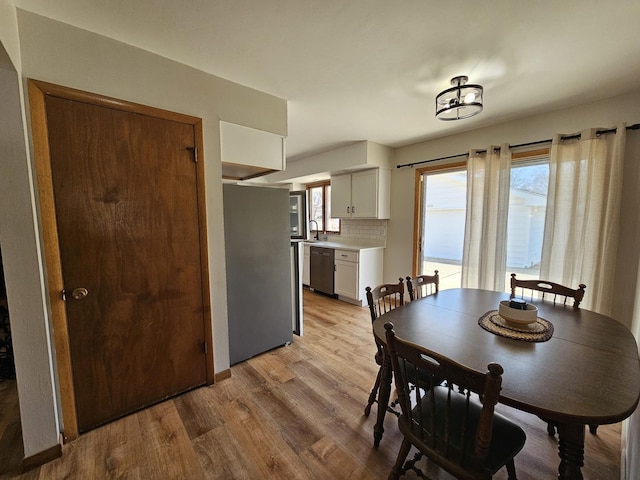 dining room featuring light wood-style floors