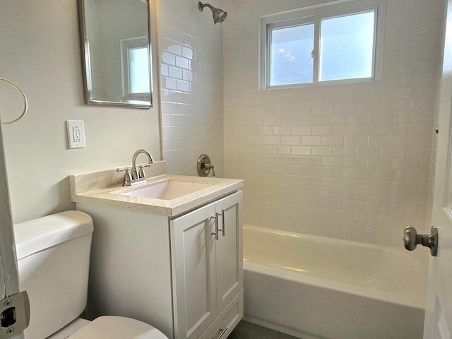 bathroom with toilet, bathtub / shower combination, and vanity