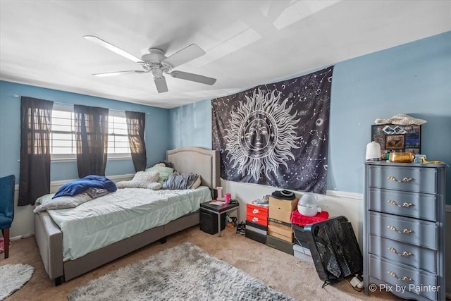 carpeted bedroom with a ceiling fan