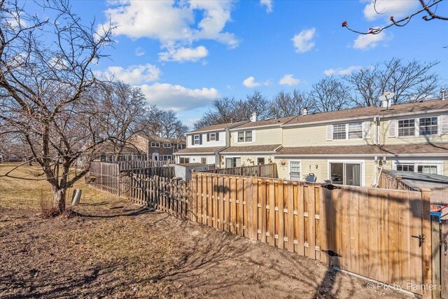 810 Bishop Ct, Schaumburg, IL 60194 - view of front of house featuring fence and stone siding