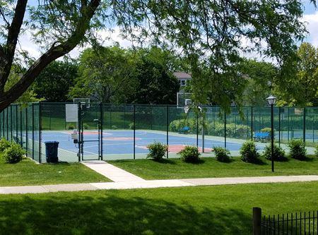 view of sport court with community basketball court, a gate, a yard, and fence