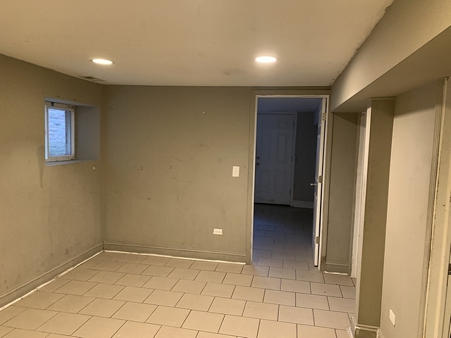 empty room with recessed lighting and baseboards