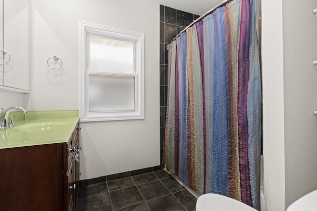 bathroom with tile patterned floors, toilet, a shower with shower curtain, and vanity