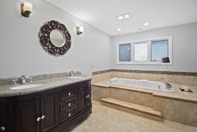 full bath with a bath, tile patterned floors, double vanity, and a sink