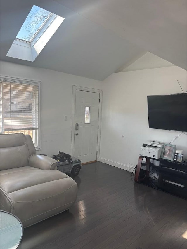 living area with vaulted ceiling with skylight, baseboards, and dark wood-style flooring