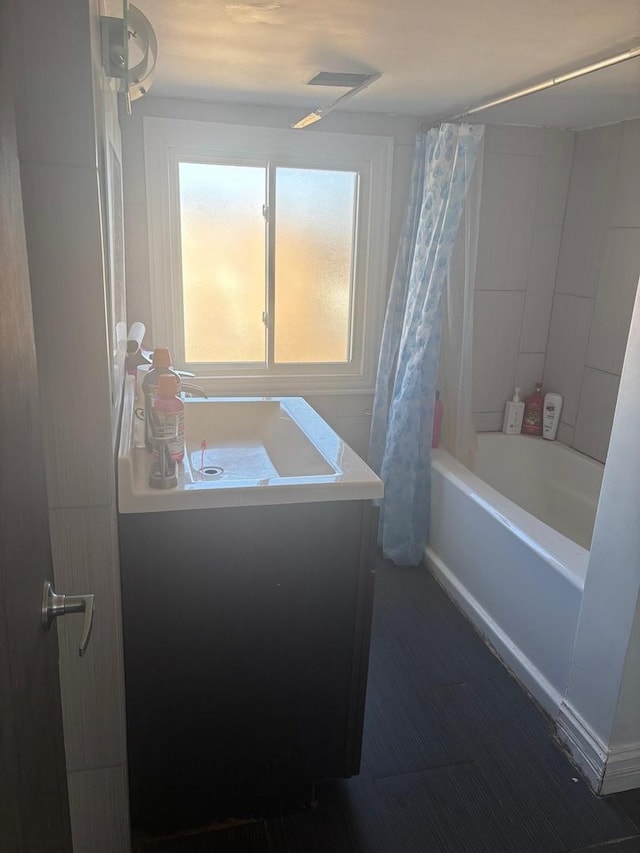 full bathroom with vanity and shower / bath combination with curtain