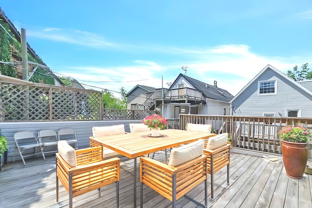 wooden deck featuring outdoor dining space