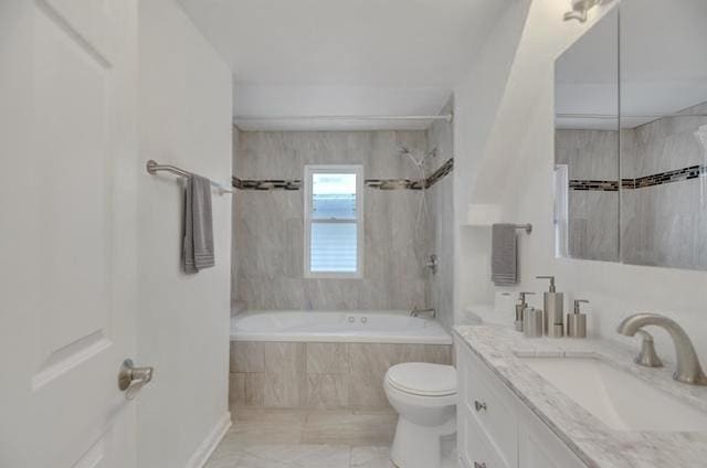 full bath featuring tiled shower / bath combo, toilet, and vanity