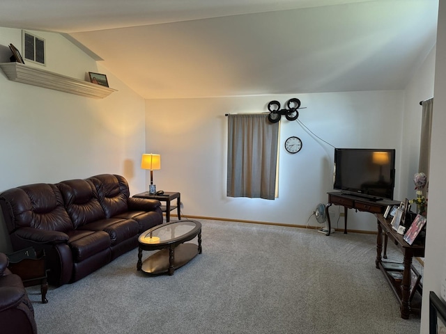 carpeted living room featuring visible vents, baseboards, and vaulted ceiling