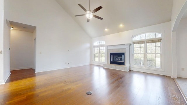 1904 Mullikin Dr, Champaign, IL 61822 - unfurnished living room featuring a fireplace, ceiling fan, wood finished floors, and plenty of natural light