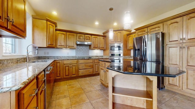 1904 Mullikin Dr, Champaign, IL 61822 - kitchen featuring light stone counters, a sink, a center island, under cabinet range hood, and stainless steel appliances