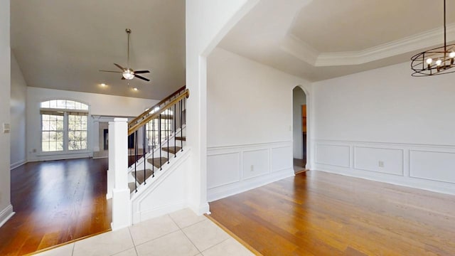 1904 Mullikin Dr, Champaign, IL 61822 - interior space with stairs, wood finished floors, ceiling fan with notable chandelier, arched walkways, and ornamental molding