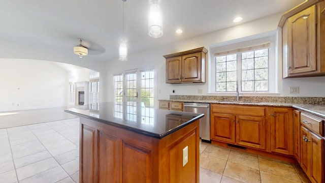 1904 Mullikin Dr, Champaign, IL 61822 - kitchen with open floor plan, a center island, stainless steel dishwasher, a sink, and visible vents