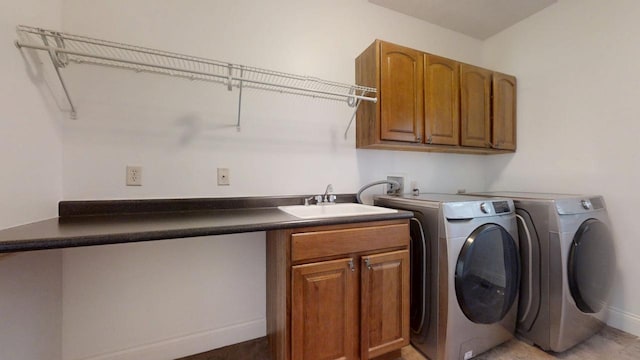 1904 Mullikin Dr, Champaign, IL 61822 - laundry area featuring baseboards, cabinet space, a sink, and washer and dryer