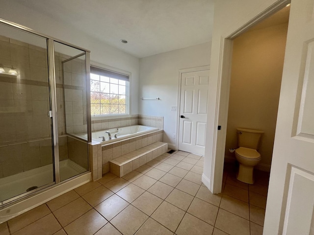 1904 Mullikin Dr, Champaign, IL 61822 - full bath featuring a stall shower, toilet, tile patterned flooring, and a garden tub