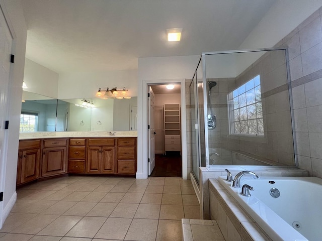 1904 Mullikin Dr, Champaign, IL 61822 - full bath with tile patterned flooring, vanity, a stall shower, a jetted tub, and a walk in closet