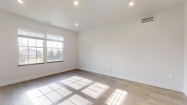 1904 Mullikin Dr, Champaign, IL 61822 - unfurnished room with light wood finished floors, baseboards, visible vents, and recessed lighting