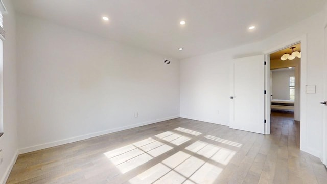 1904 Mullikin Dr, Champaign, IL 61822 - unfurnished room with light wood-style flooring, recessed lighting, baseboards, and visible vents