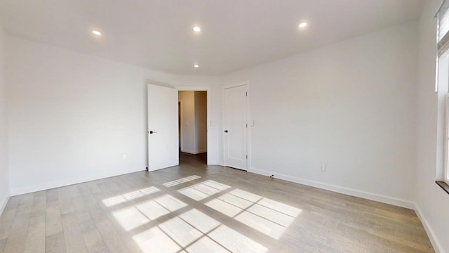 1904 Mullikin Dr, Champaign, IL 61822 - empty room with baseboards, light wood finished floors, and recessed lighting