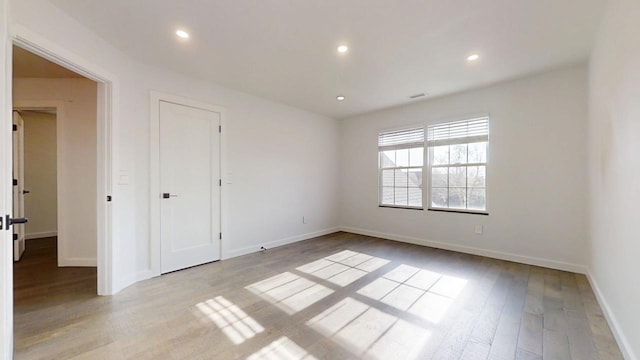 1904 Mullikin Dr, Champaign, IL 61822 - unfurnished bedroom with baseboards, light wood-type flooring, visible vents, and recessed lighting