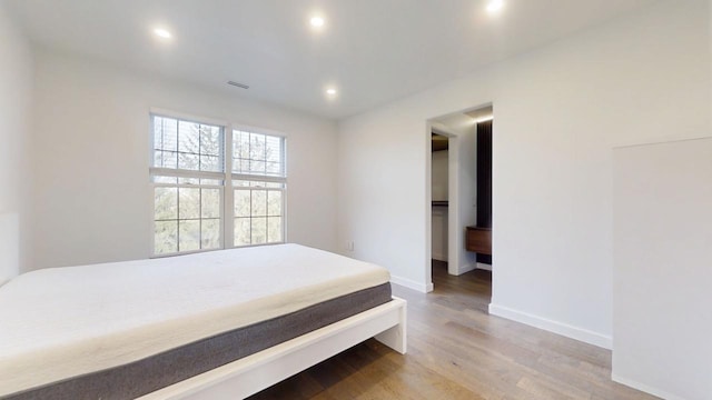 1904 Mullikin Dr, Champaign, IL 61822 - bedroom featuring baseboards, wood finished floors, and recessed lighting