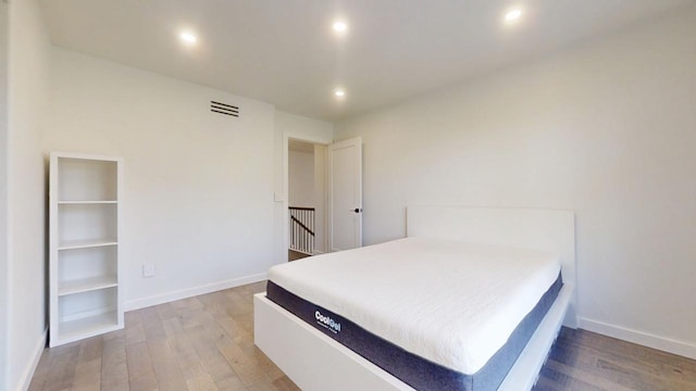 1904 Mullikin Dr, Champaign, IL 61822 - bedroom with baseboards, visible vents, wood finished floors, and recessed lighting