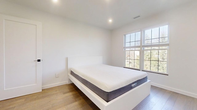 1904 Mullikin Dr, Champaign, IL 61822 - bedroom with baseboards, visible vents, wood finished floors, and recessed lighting