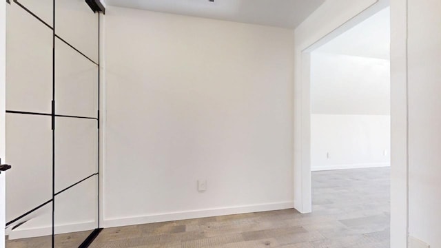 1904 Mullikin Dr, Champaign, IL 61822 - unfurnished room with baseboards and wood finished floors