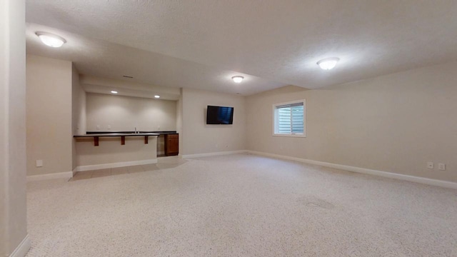 1904 Mullikin Dr, Champaign, IL 61822 - basement with baseboards and a textured ceiling