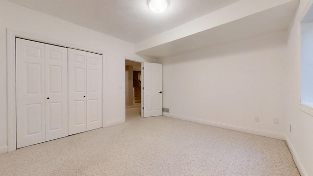 1904 Mullikin Dr, Champaign, IL 61822 - unfurnished bedroom with baseboards, visible vents, a closet, and carpet