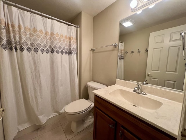 1904 Mullikin Dr, Champaign, IL 61822 - bathroom featuring toilet, tile patterned flooring, and vanity