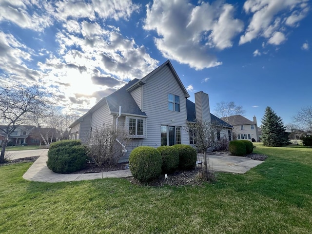 1904 Mullikin Dr, Champaign, IL 61822 - rear view of house featuring a patio and a yard