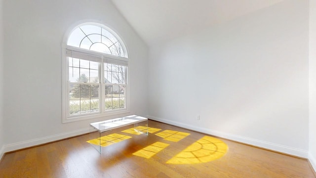 1904 Mullikin Dr, Champaign, IL 61822 - unfurnished room with baseboards, lofted ceiling, and wood finished floors