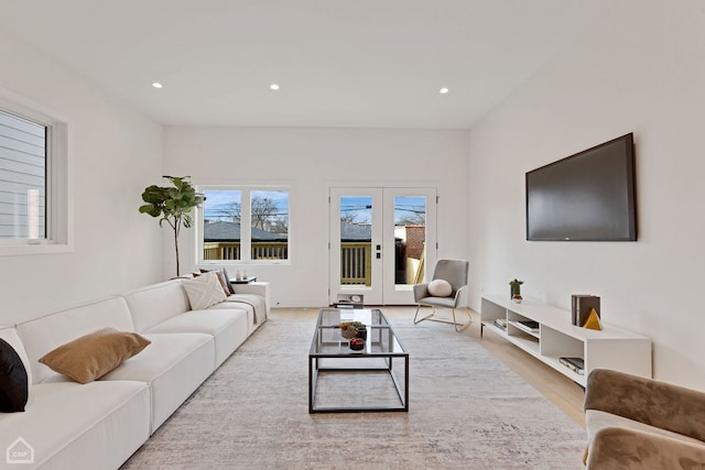 living room with recessed lighting, french doors, and wood finished floors