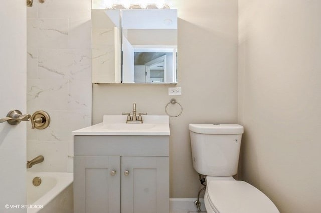 bathroom featuring toilet and vanity