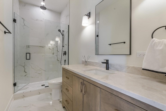 full bath featuring a marble finish shower, marble finish floor, toilet, and vanity