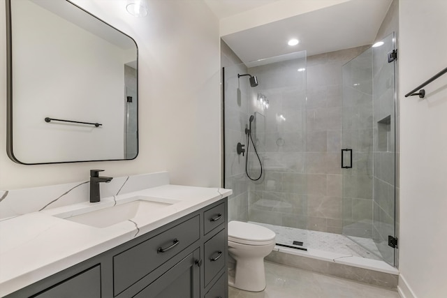 bathroom featuring recessed lighting, a shower stall, toilet, and vanity