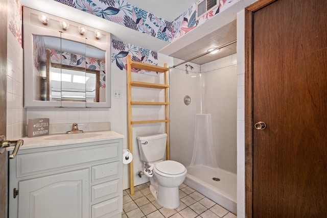 full bathroom with tile patterned floors, vanity, toilet, and a shower stall