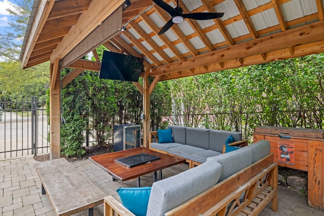 view of patio / terrace with a gate, an outdoor hangout area, a ceiling fan, and fence