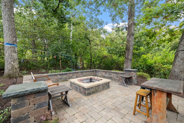 view of patio featuring a fire pit