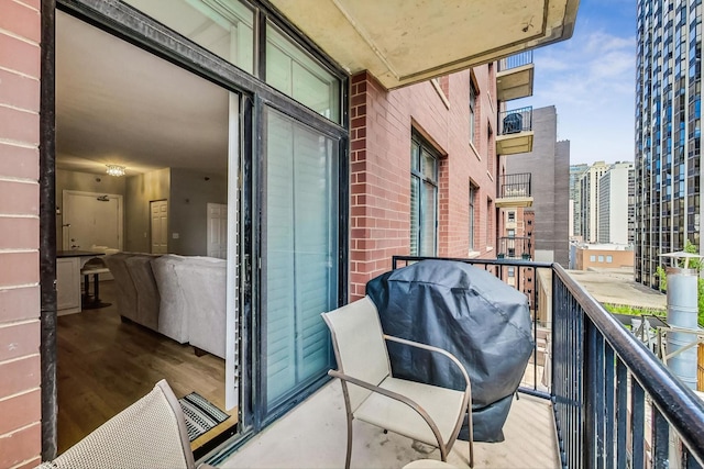 balcony with a city view and a grill