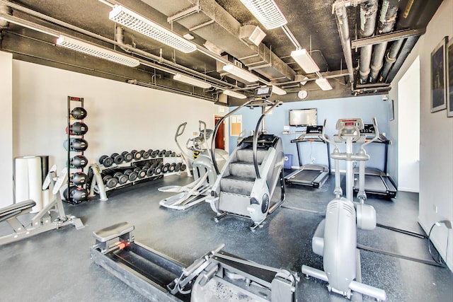 gym featuring baseboards