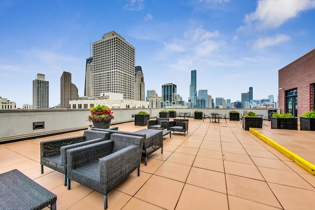 view of patio / terrace featuring a view of city and outdoor lounge area