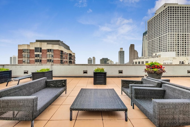 view of patio with outdoor lounge area and a view of city