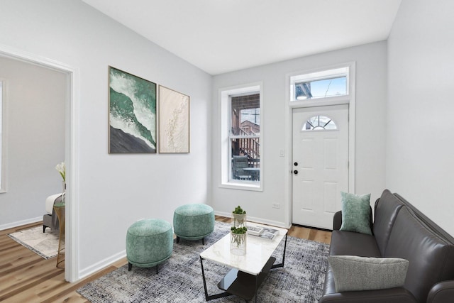 living room with light wood-style floors and baseboards