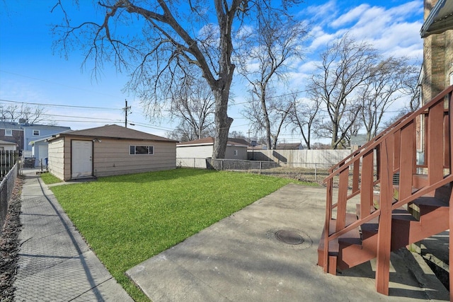 view of yard with a fenced backyard, an outdoor structure, and a patio