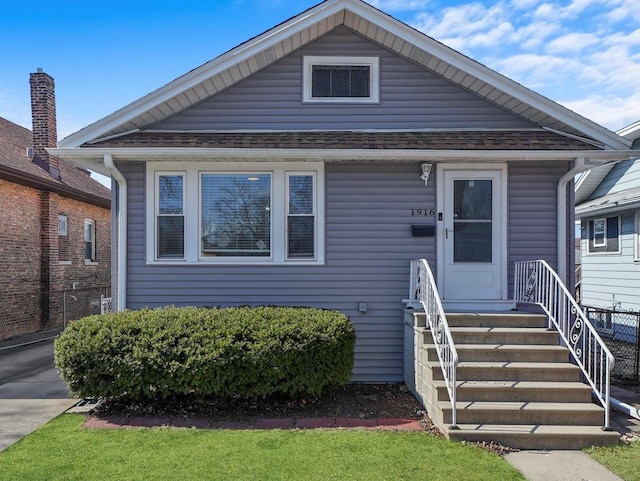 bungalow with roof with shingles