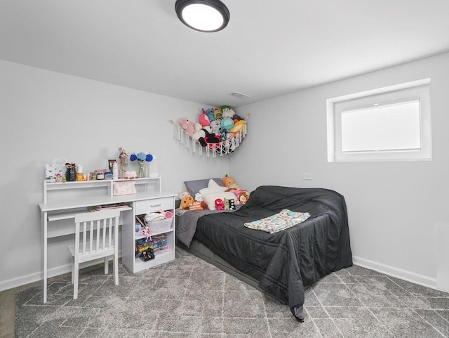 bedroom featuring visible vents, baseboards, and carpet floors