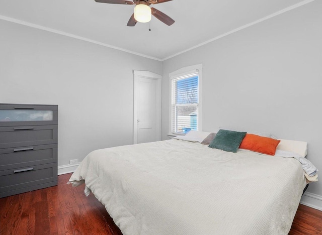 bedroom with ceiling fan, dark wood-type flooring, baseboards, and ornamental molding