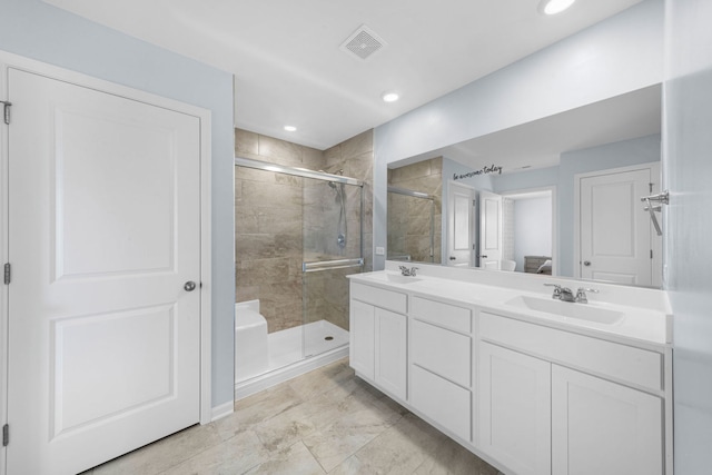 bathroom featuring visible vents, a sink, recessed lighting, a shower stall, and double vanity